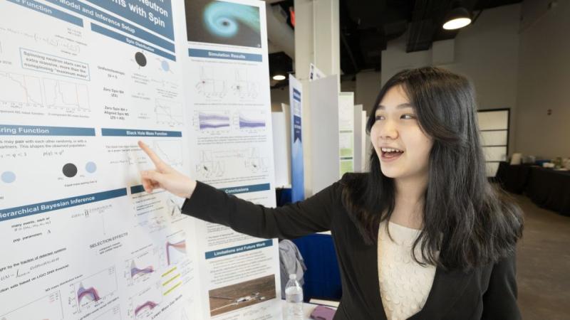 Christine Ye presenting her research on gravitational waves.