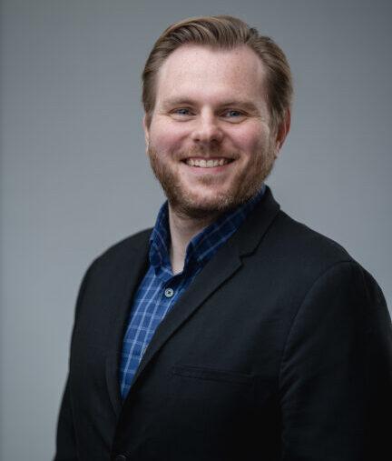 headshot of Steve Taylor smiling