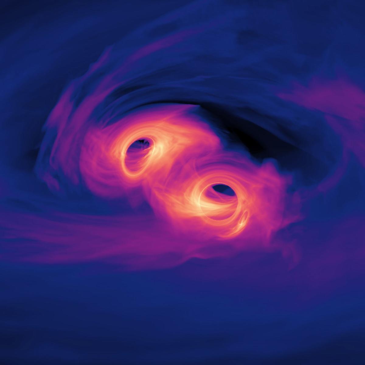 Visualization of a computer simulation showing two super massive black holes orbiting one another closely.